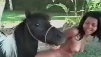 She is trying to swallow a big horse dick