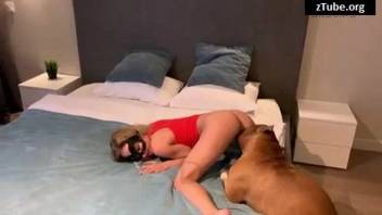 Bestiality adult film featuring a sexy blond woman