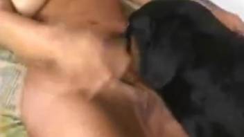 Stunning female engaging in intercourse with a canine in extreme close-up