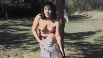 Woman having sex with a horse in a threesome clip